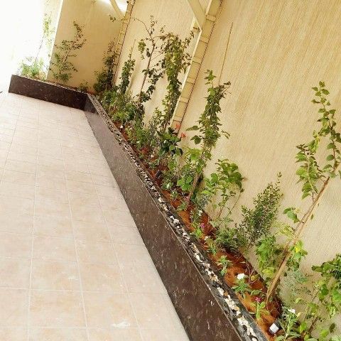 تنسيق حدائق شلالات عشب صناعي جلسات مرتفعه ثيل طبيع